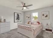 Thumbnail 6 of 18 - a carpeted bedroom with a ceiling fan, window, and virtual furnishings at Rock Creek