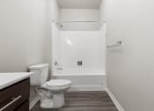 Thumbnail 11 of 24 - a River Flats bathroom with a toilet and a tub/shower and a sink