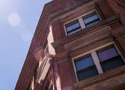 Thumbnail 1 of 12 - brick and concrete apartment building with large windows at 12 Allen St in Buffalo, NY