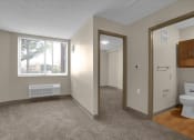 Thumbnail 5 of 28 - a bathroom with a window and a toilet and a mirror