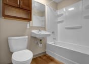 Thumbnail 21 of 28 - a bathroom with a toilet sink and a shower