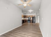 Thumbnail 3 of 24 - an open and airy living room and kitchen with a ceiling fan and overhead lighting