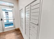 Thumbnail 8 of 26 - A white mailbox with the number 31 on it is on the side of a building.