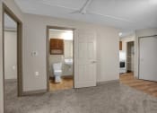 Thumbnail 14 of 28 - a living room with a toilet and a bathroom