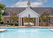Thumbnail 11 of 56 - large beautiful pool in front of building at Fenwyck Manor Apartments in Chesapeake, VA