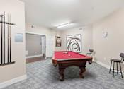 Thumbnail 10 of 19 - A pool table is in the middle of the room.at The Lodge at Johns Road Apartments, Huntsville, AL, 35806
