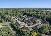 Thumbnail 27 of 28 - A bird's eye view of a residential area with houses and trees.