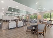 Thumbnail 14 of 24 - the large resident community room with ample seating at River Flats Apartments