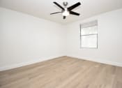 Thumbnail 32 of 36 - an empty room with white walls and a ceiling fan