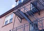 Thumbnail 10 of 12 - a fire escape on the side of a building