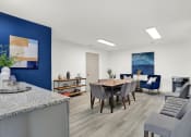 Thumbnail 9 of 18 - The newly renovated clubhouse with ample seating and a conference table at Rock Creek Apartments