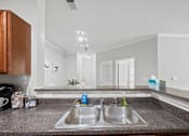 Thumbnail 26 of 56 - a kitchen sink and countertop in an apartment at Centerville Manor in Virginia Beach