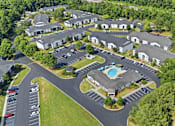 Thumbnail 40 of 41 - A bird's eye view of a resort with a swimming pool.