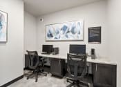 Thumbnail 22 of 25 - two desks with computers in Brooke Street Lofts business center