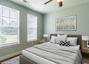 Thumbnail 5 of 26 - A bedroom with a bed, two lamps, and a painting on the wall.