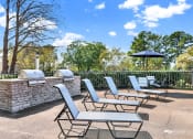 Thumbnail 16 of 18 - the new lounge chairs by the double grilling station at Rock Creek Apartments