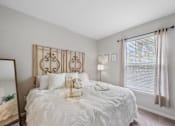 Thumbnail 37 of 56 - a bedroom with a large bed and a large window in Centerville Manor Model apartment