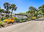 Thumbnail 5 of 37 - A road leading to a sign that says Bellas Apartments.