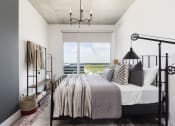 Thumbnail 25 of 42 - bedroom with large window and high ceiling at Lake Nona Pixon, Orlando, Florida