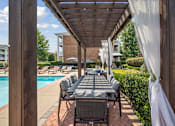 Thumbnail 50 of 56 - the covered outdoor dining and lounge area at Centerville Manor Apartments