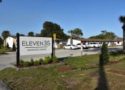 Thumbnail 1 of 29 - The Eleven35 Apartments sign at the entrance of the community