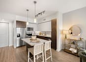 Thumbnail 18 of 40 - A modern kitchen with a dining table and chairs.