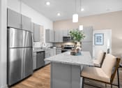 Thumbnail 26 of 43 - a kitchen with stainless steel appliances and a marble counter top
