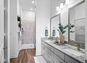 Thumbnail 36 of 43 - a bathroom with a sink and a shower