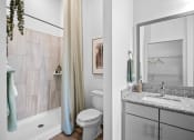 Thumbnail 37 of 43 - a bathroom with a toilet sink and shower and a mirror