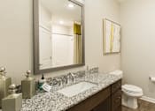 Thumbnail 18 of 30 - spacious bathroom vanity and toilet nook
