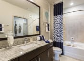 Thumbnail 19 of 42 - Luxurious bathroom with granite countertops  at LandonHouse Apartments in Lake Nona, Orlando, FL 32827