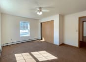Thumbnail 18 of 24 - a bedroom with ample natural light from the large windows at Algonquin Manor