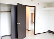 Thumbnail 8 of 13 - A black door with a gold handle is open.