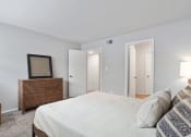 Thumbnail 10 of 14 - a spacious bedroom with model furnishings and plush carpeting
