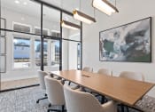 Thumbnail 5 of 48 - the spacious glassed in conference room with a large conference table and chairs in Sanctuary at Indian Creek Clubhouse