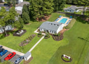 Thumbnail 1 of 28 - an aerial view of a house and yard with a swimming pool