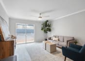 Thumbnail 3 of 14 - an apartment living area with model furnishings and lots of natural light at Mountainside Apartments