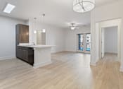 Thumbnail 3 of 37 - a renovated living room and kitchen with a large open floor plan