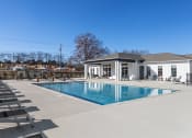 Thumbnail 14 of 48 - the swimming pool and sundeck behind the clubhouse at Sanctuary at Indian Creek Rental Homes in North Alabama