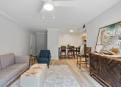 Thumbnail 1 of 14 - a living room with wood-style flooring and model decor at Mountainside Apartments