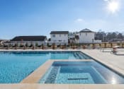 Thumbnail 17 of 48 - the large swimming pool, spa, and sundeck surrounded by homes at Sanctuary at Indian Creek Rental Homes in Huntsville