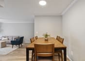 Thumbnail 4 of 14 - a dining set in the dining area in an apartment home for rent at Mountainside Apartments