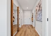 Thumbnail 33 of 48 - a hallway with white walls and wood-like floors in a Sanctuary at indian Creek Rental Home