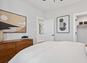 Thumbnail 35 of 48 - a bedroom with a walk-in closet and model furniture at Sanctuary at Indian Creek rental homes in Madison, AL