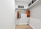Thumbnail 40 of 48 - a large walk-in closet with hanging bars and built-in shelving in a home at Sanctuary at Indian Creek homes for rent