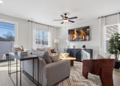 Thumbnail 41 of 48 - a spacious, furnished living room with large windows and glass doors to a private back yard in a home at Sanctuary at Indian Creek