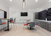 Thumbnail 21 of 37 - a conference room with a table and chairs and a television