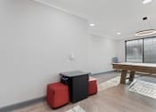 Thumbnail 26 of 37 - a game room with a ping pong table and a pool table