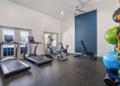 Thumbnail 7 of 28 - the gym with treadmills and weights at the grove at cottonwood apartments