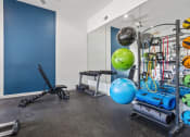 Thumbnail 3 of 28 - the gym with weights and other exercise equipment at the flats